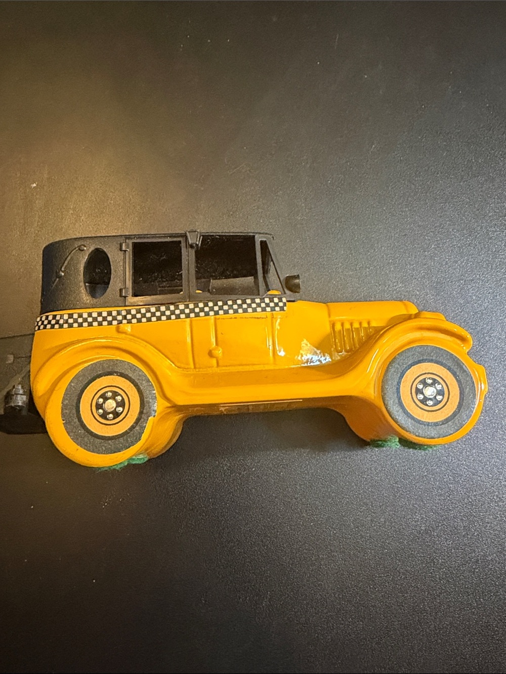 Vintage Yellow and Black Cab Avon cologne bottle.
